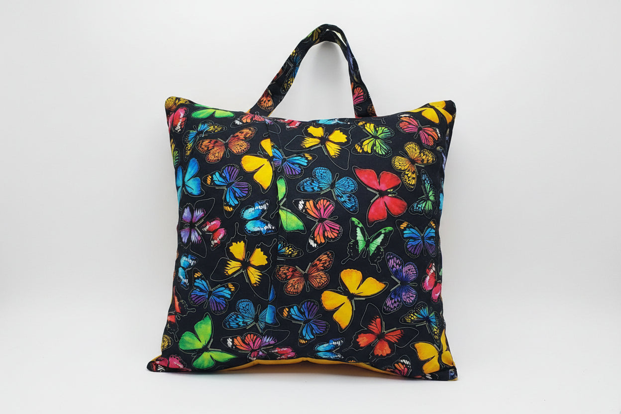 Bring color and creativity to every story with this handmade Butterfly Garden Reading Pillow Cover. Featuring vibrant butterfly fabrics, embroidered butterfly accents, a roomy front book pocket, and a sturdy carry handle, it's perfect for bedtime stories, classrooms, travel, and cozy reading corners.